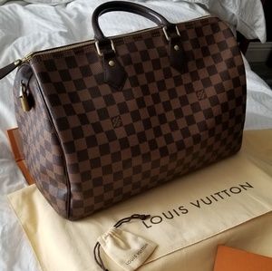 Damier Ebony 35 purse like new.